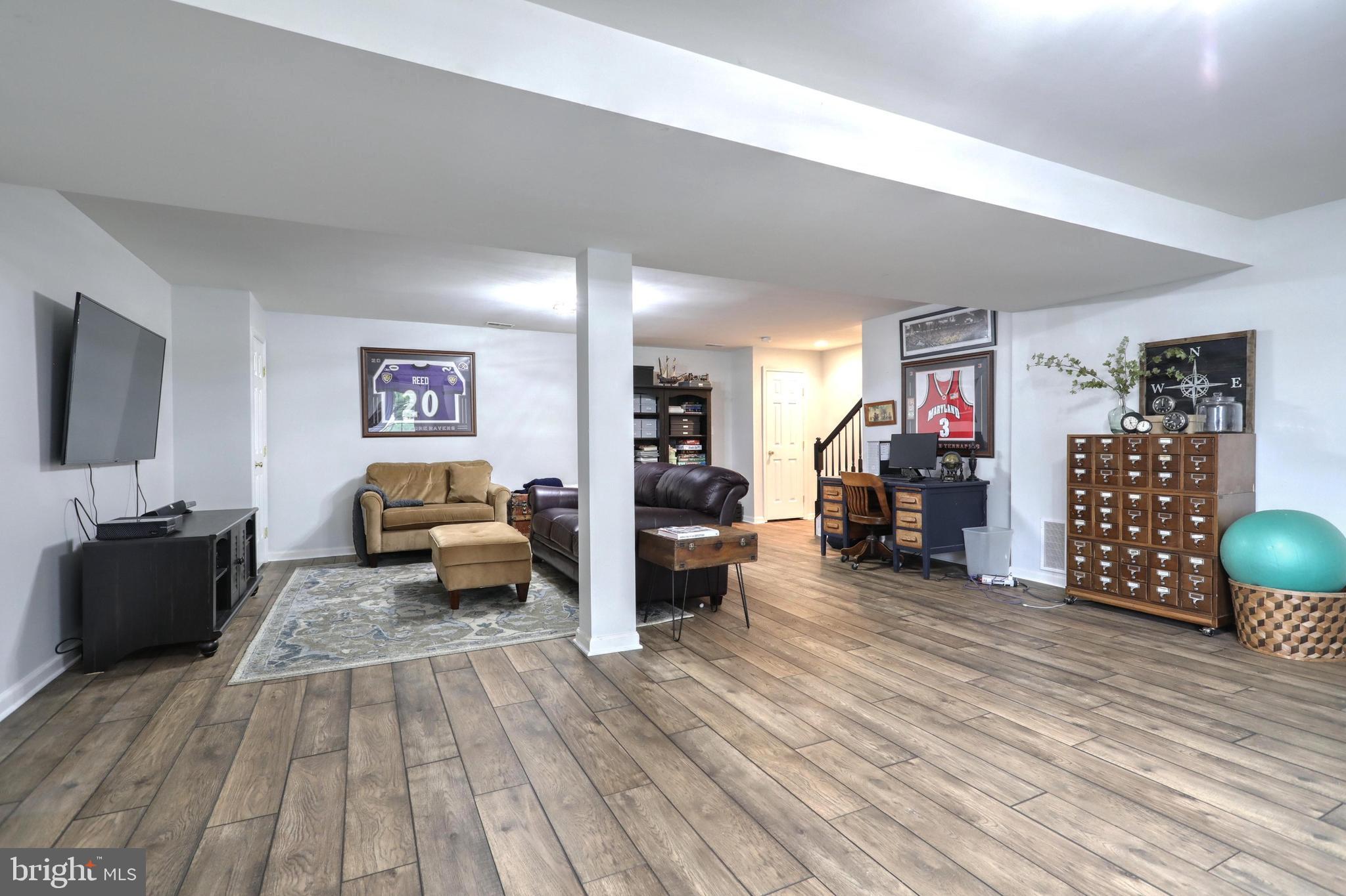 48 Smith Mill Road New Freedom, PA 17349 - Photo 36 of 40 Finished basement with newly installed vinyl plank