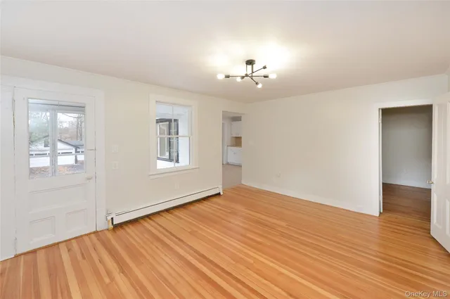 a view of balcony with wooden floor
