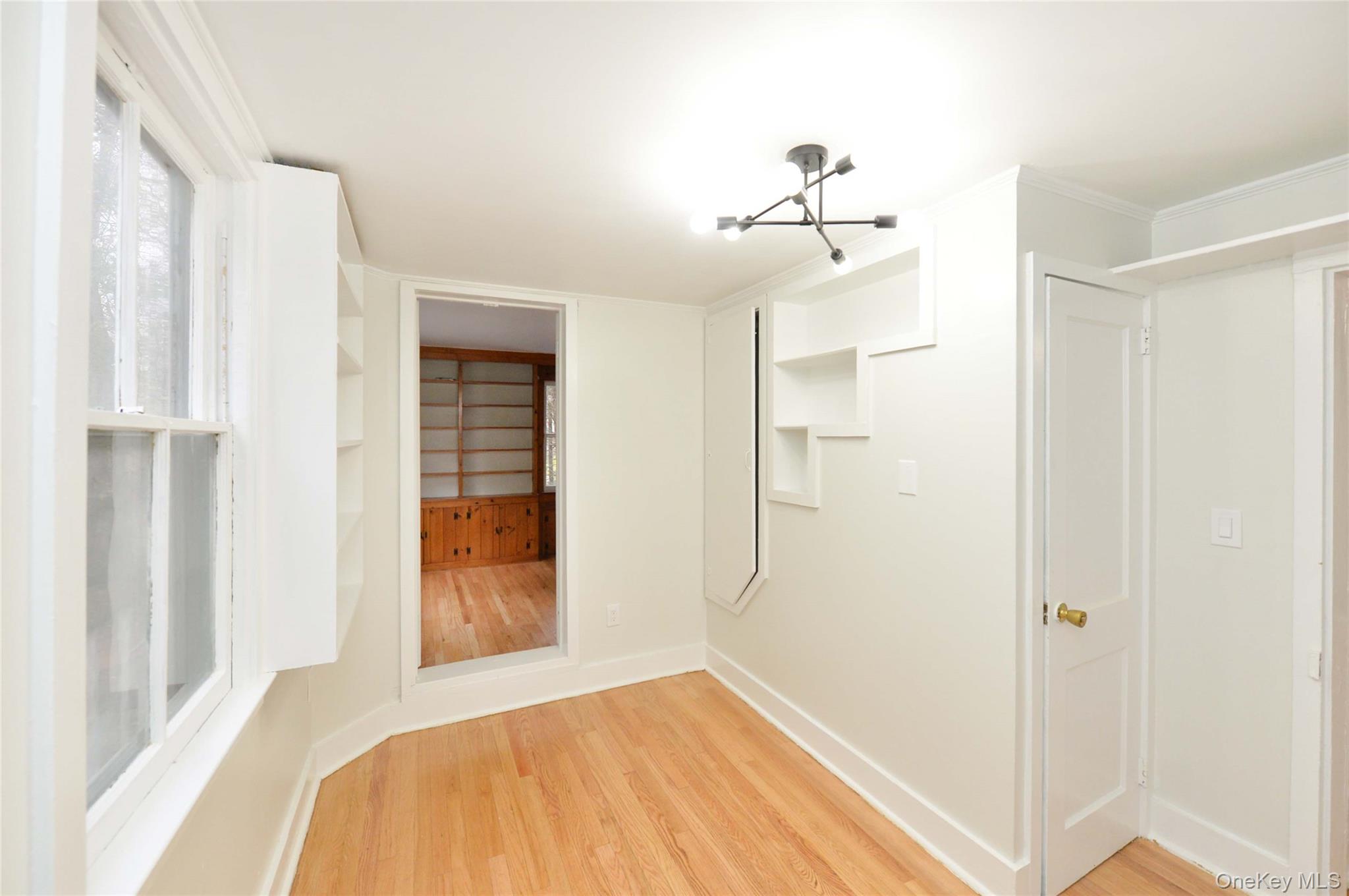 19 Johnsontown Road Sloatsburg, NY 10974 - Photo 12 of 41 a bedroom with a bed and a chandelier