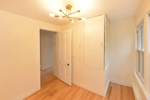 a view of a room with wooden walls