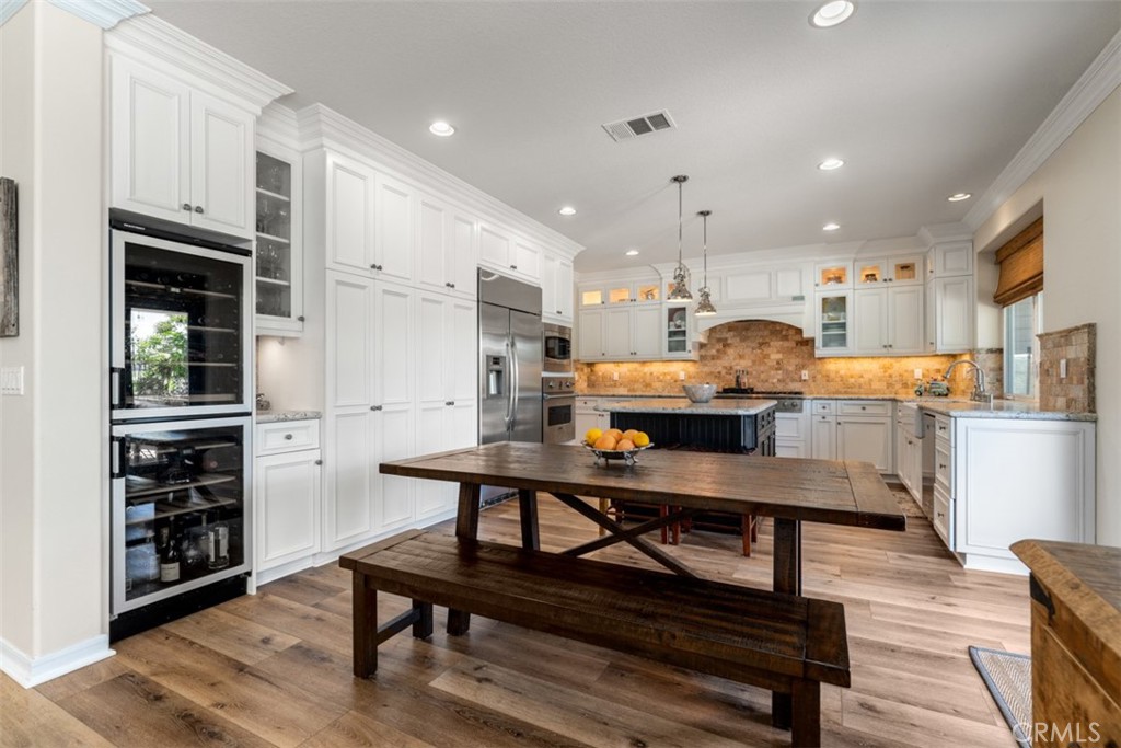 124 Nighthawk Irvine, CA 92604 - Photo 11 of 61 a room with stainless steel appliances furniture a refrigerator and kitchen view