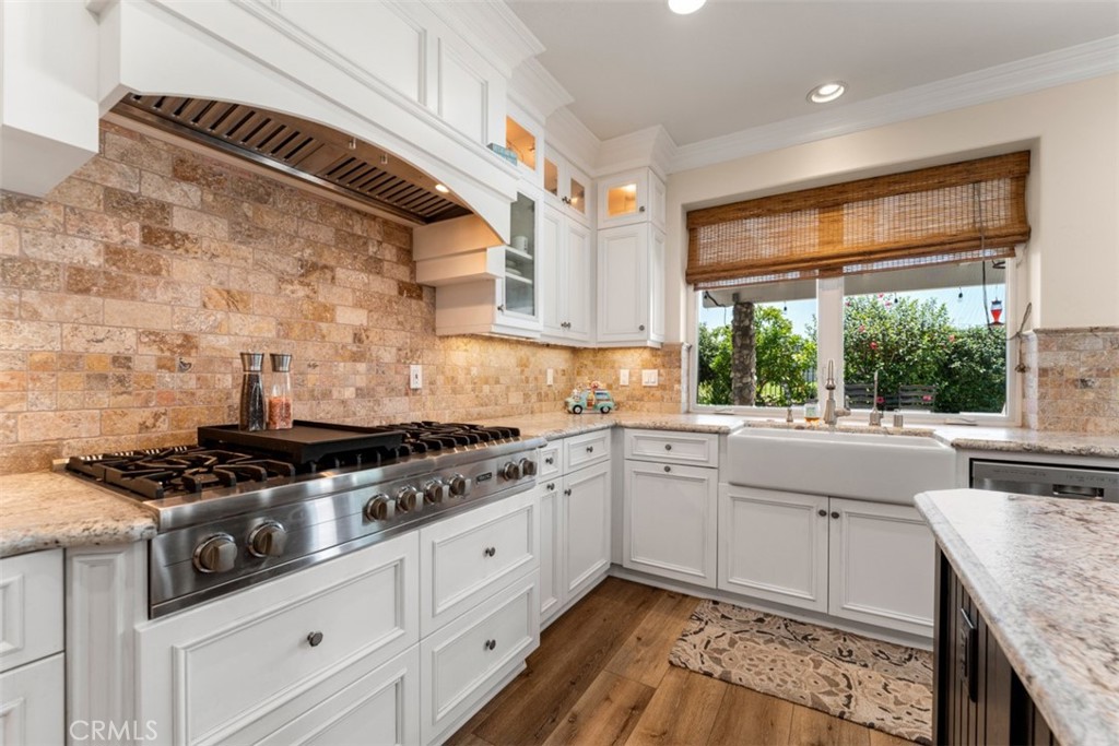 124 Nighthawk Irvine, CA 92604 - Photo 15 of 61 a kitchen with granite countertop cabinets stainless steel appliances and a stove