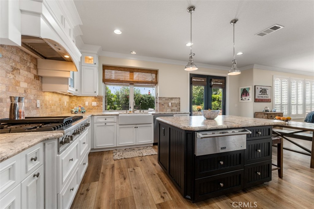 124 Nighthawk Irvine, CA 92604 - Photo 16 of 61 a kitchen with granite countertop a stove and a sink