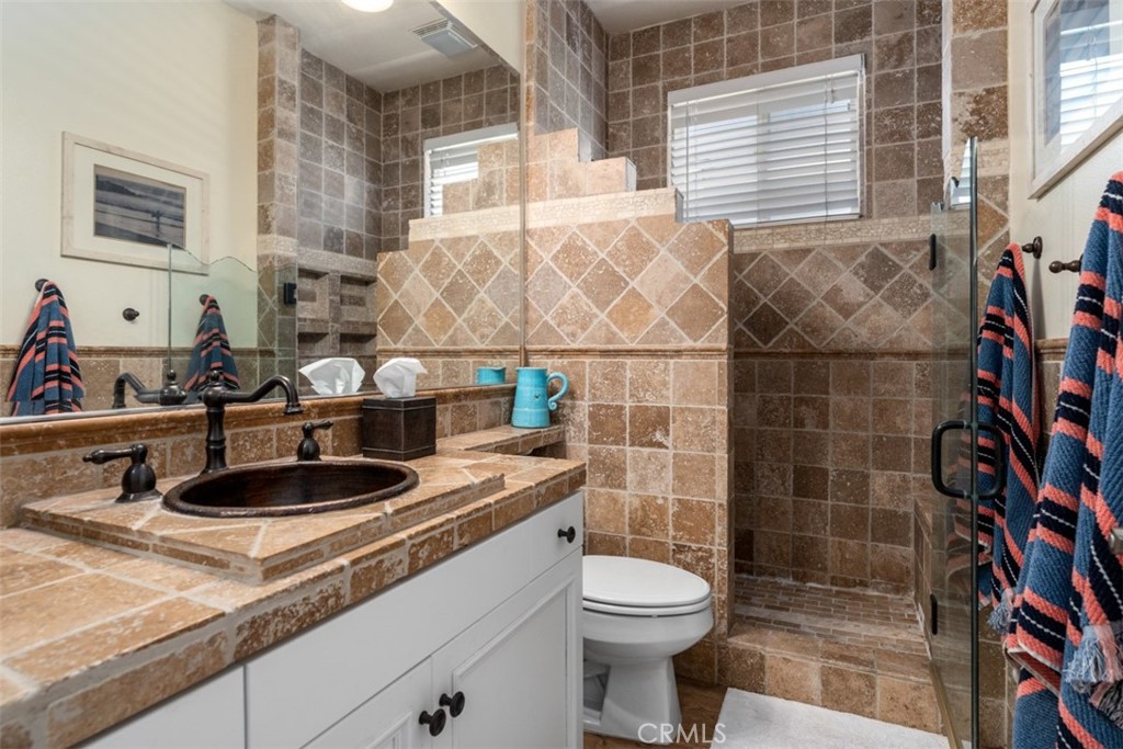 124 Nighthawk Irvine, CA 92604 - Photo 21 of 61 a bathroom with a sink a toilet and shower