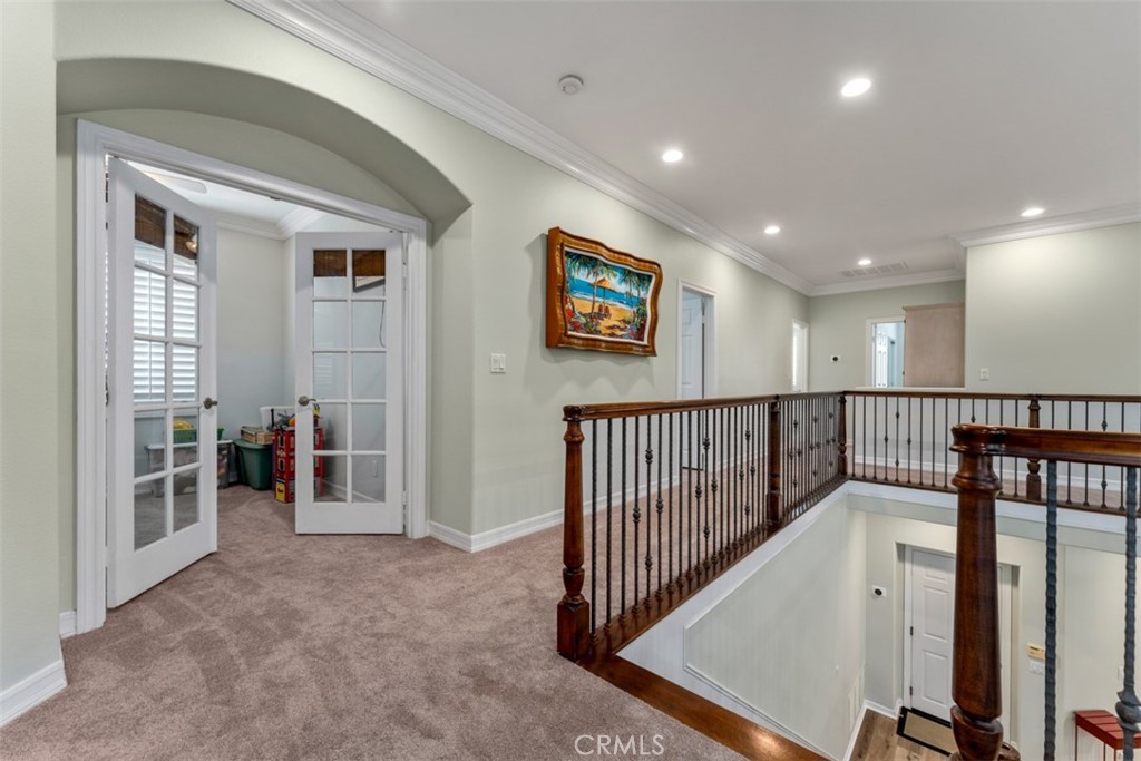 124 Nighthawk Irvine, CA 92604 - Photo 25 of 61 a view of a hallway with workspace and windows