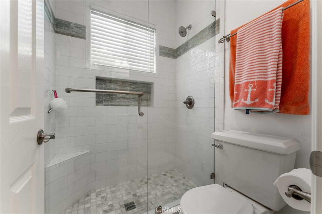 124 Nighthawk Irvine, CA 92604 - Photo 28 of 61 a bathroom with a toilet and a shower