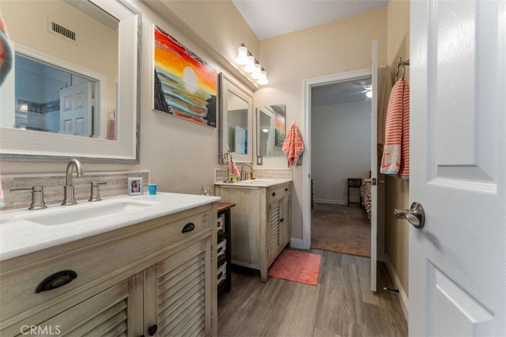 124 Nighthawk Irvine, CA 92604 - Photo 29 of 61 a bathroom with a sink and a mirror