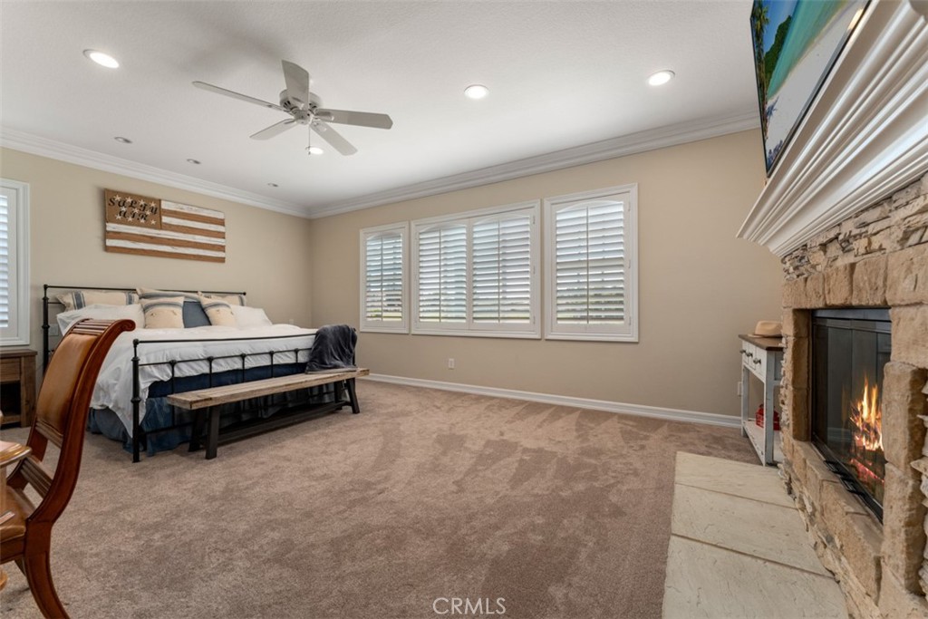 124 Nighthawk Irvine, CA 92604 - Photo 40 of 61 a bedroom with a bed and a flat screen tv