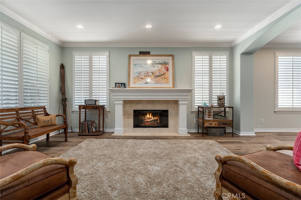 124 Nighthawk Irvine, CA 92604 - Photo 4 of 61 a living room with furniture and a fireplace