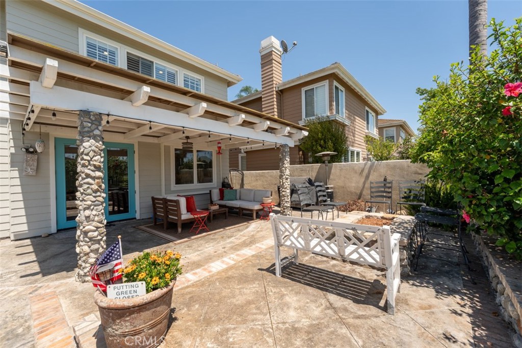 124 Nighthawk Irvine, CA 92604 - Photo 51 of 61 a front view of a house with outdoor seating and potted plants