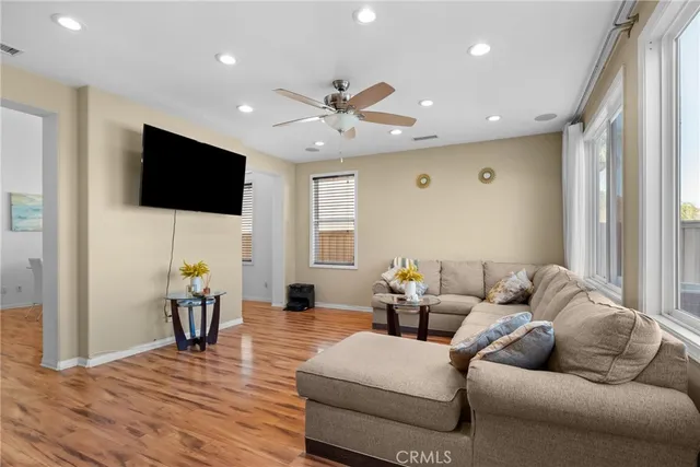 a kitchen with a sink a counter top space cabinets and stainless steel appliances