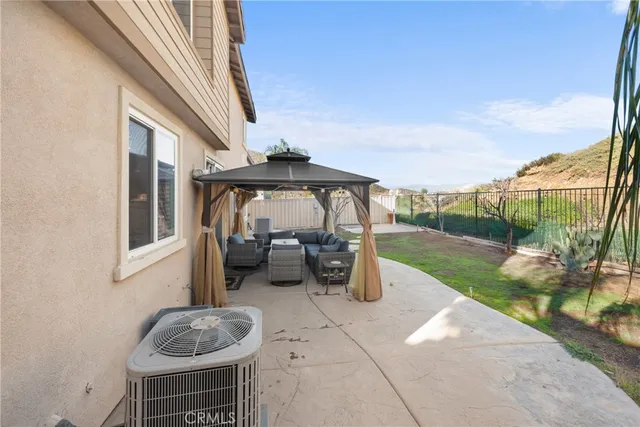 a view of a house with a yard porch and sitting area