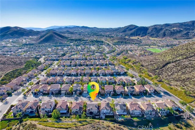 a view of a field with sitting area