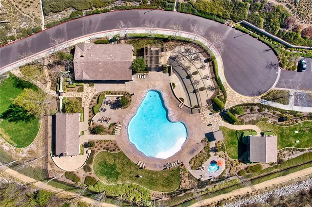 a view of a patio with a table and chairs under an umbrella