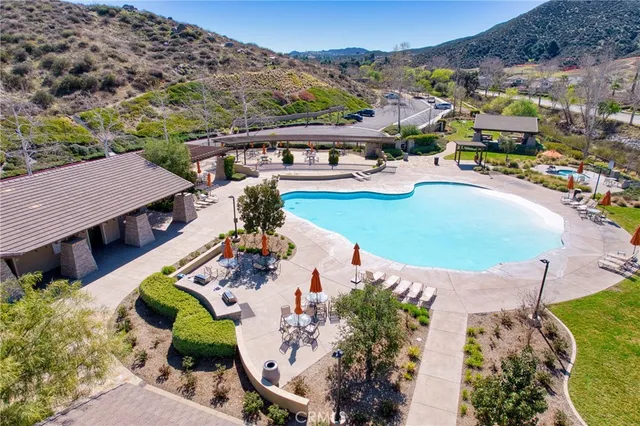 aerial view of a house with a yard and a garden