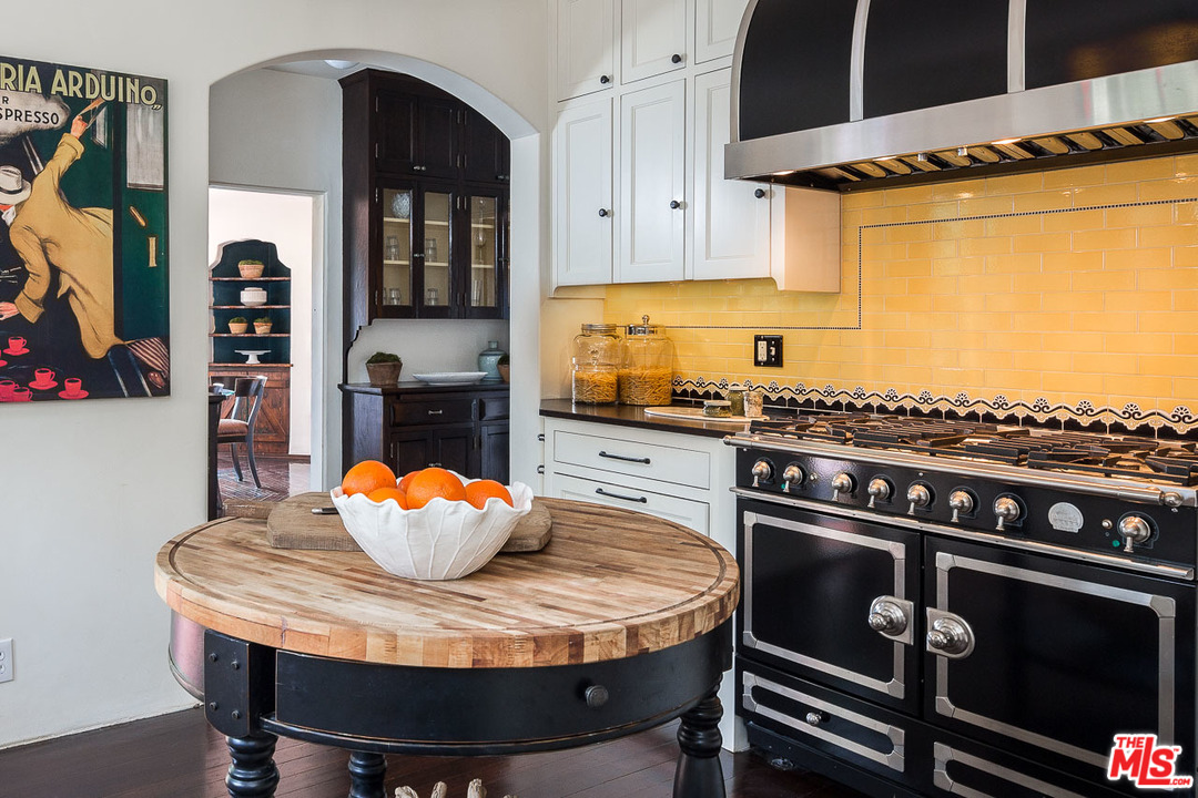 4342 Cedarhurst Circle Los Angeles, CA 90027 - Photo 14 of 44 a kitchen with a stove and a dining table