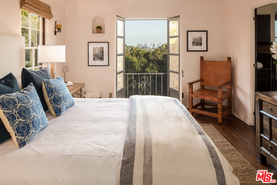 4342 Cedarhurst Circle Los Angeles, CA 90027 - Photo 25 of 44 a bedroom with a bed and a flat tv screen on wall