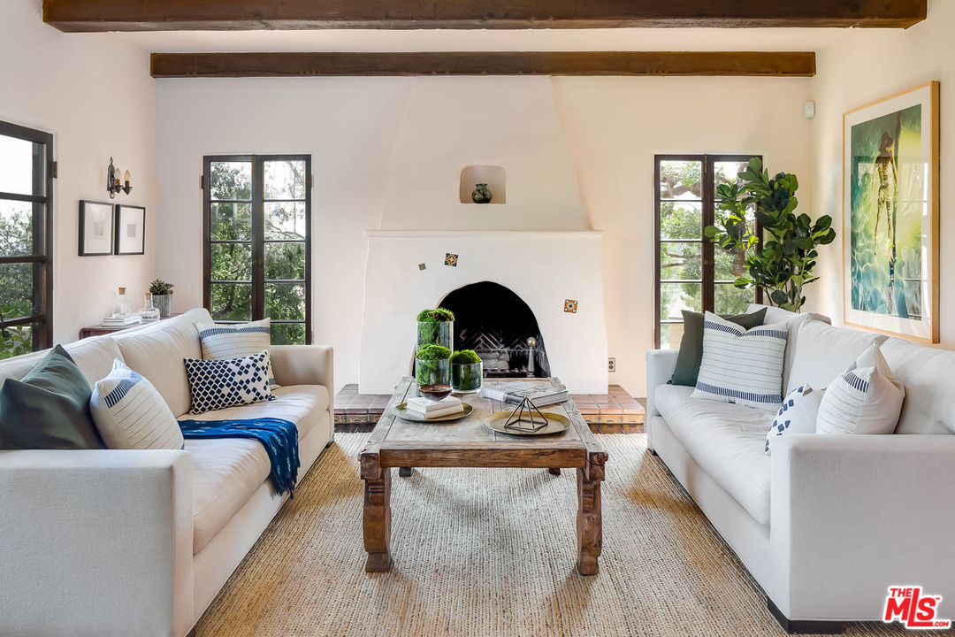 4342 Cedarhurst Circle Los Angeles, CA 90027 - Photo 7 of 44 a living room with furniture a fireplace and a potted plant