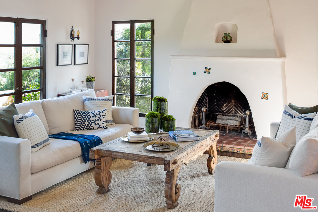 4342 Cedarhurst Circle Los Angeles, CA 90027 - Photo 8 of 44 a living room with furniture a fireplace and window
