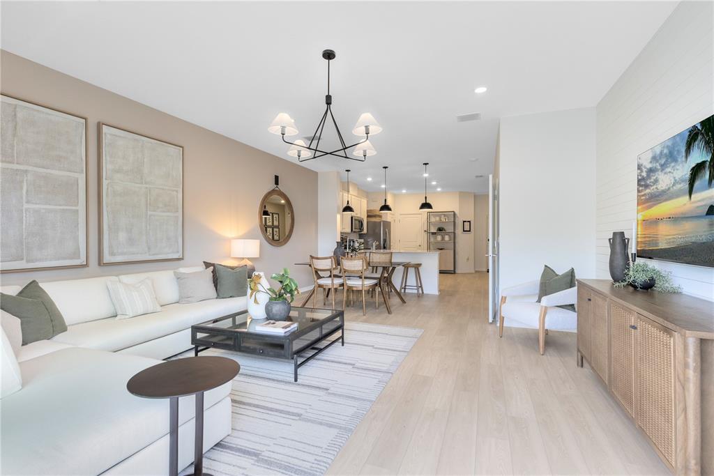 4315 Jetty Lane Palm Bay, FL 32905 - Photo 14 of 32 a living room with furniture and a chandelier