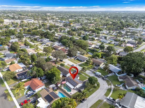 an aerial view of residential houses with outdoor space