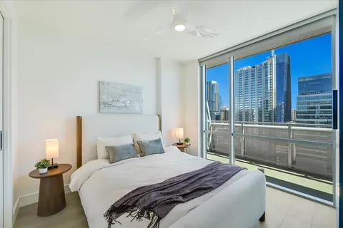 a picture of a room with table and a mirror