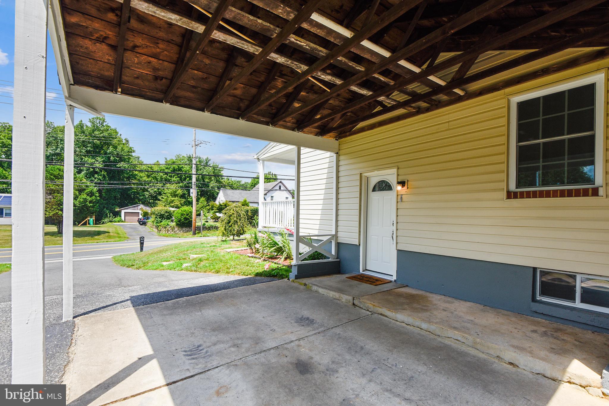 Carport with Access to Kitchen and Basement