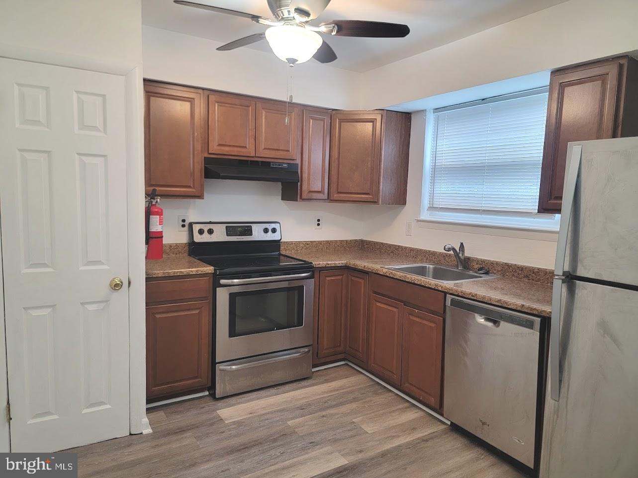 59 Noble Road Sicklerville, NJ 08081 - Photo 6 of 12 a kitchen with stainless steel appliances granite countertop a sink stove and refrigerator