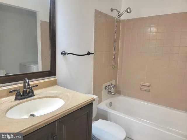 a bathroom with a sink toilet and bathtub