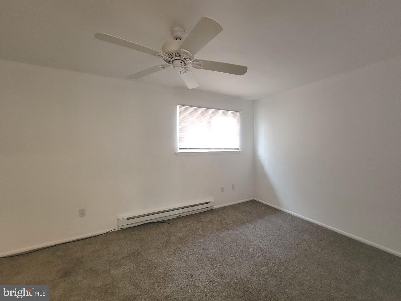59 Noble Road Sicklerville, NJ 08081 - Photo 10 of 12 an empty room with a window and a fan