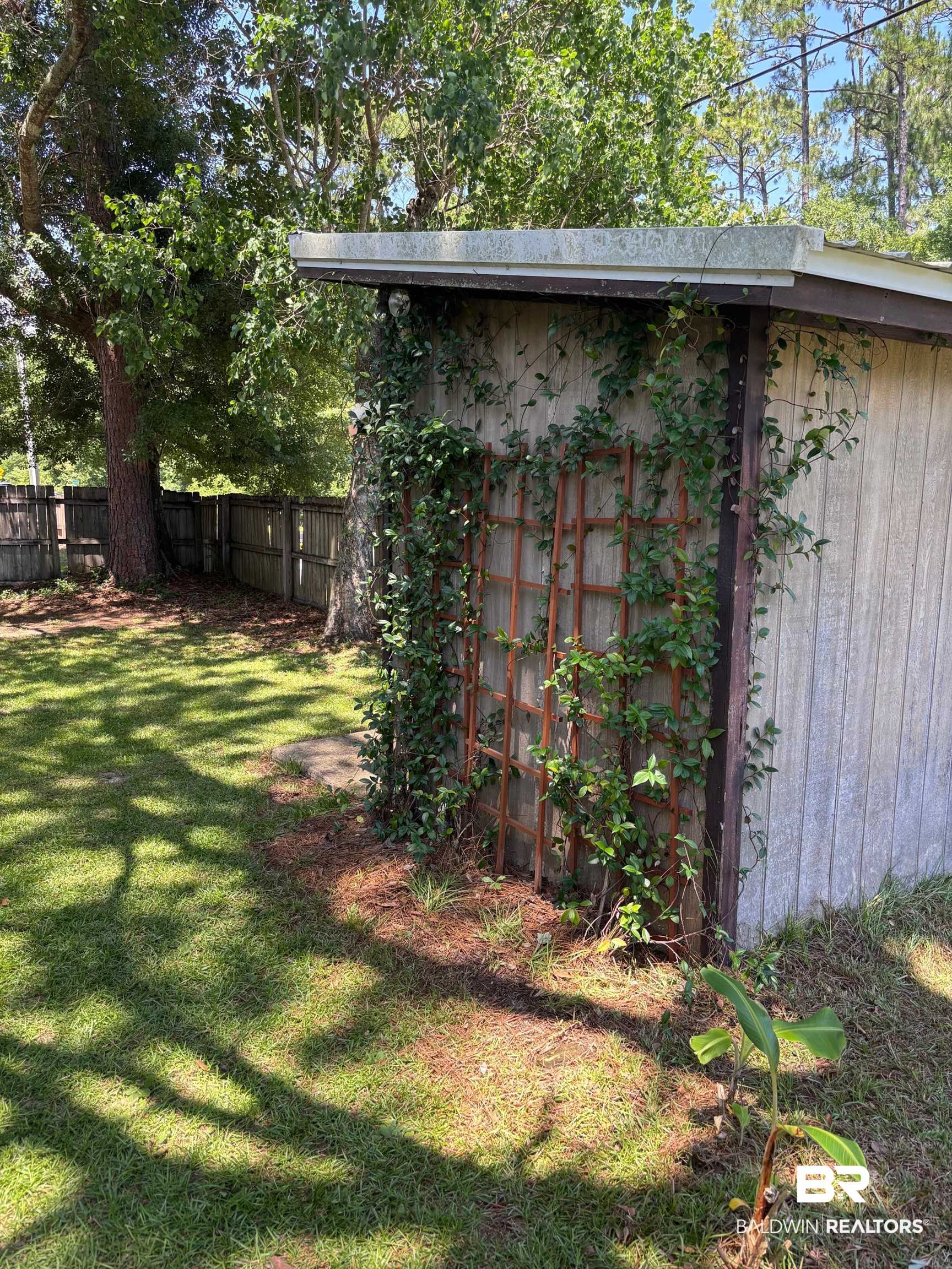 1434 Ridgewood Drive Lillian, AL 36549 - Photo 24 of 45 Fenced backyard featuring an outdoor structure