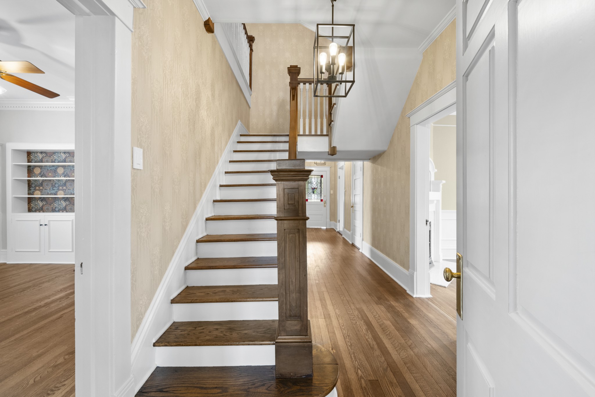 343 Forrest Street Lewisburg, TN 37091 - Photo 13 of 84 a view of staircase with lots of frames and wooden floor