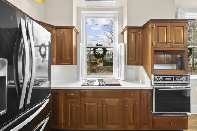 a view of a livingroom with wooden floor and window