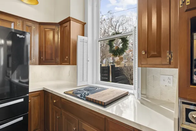 a view of a livingroom with wooden floor and fireplace