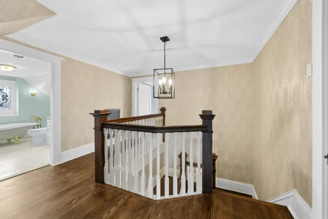 a view of walk in closet with wooden floor