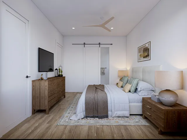 a bedroom with a bed and flat screen tv
