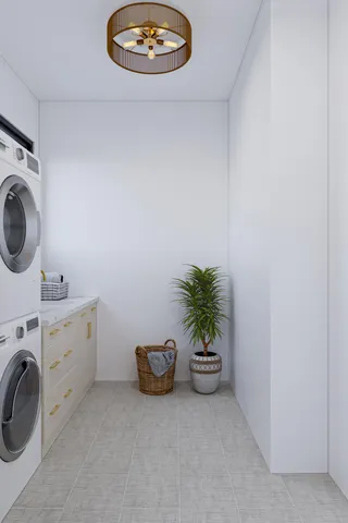 a view of a storage and utility room with washer and dryer