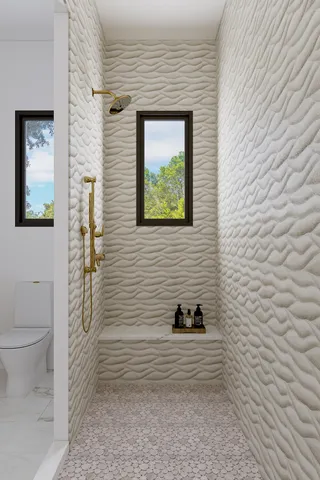 a bathroom with a toilet and a shower