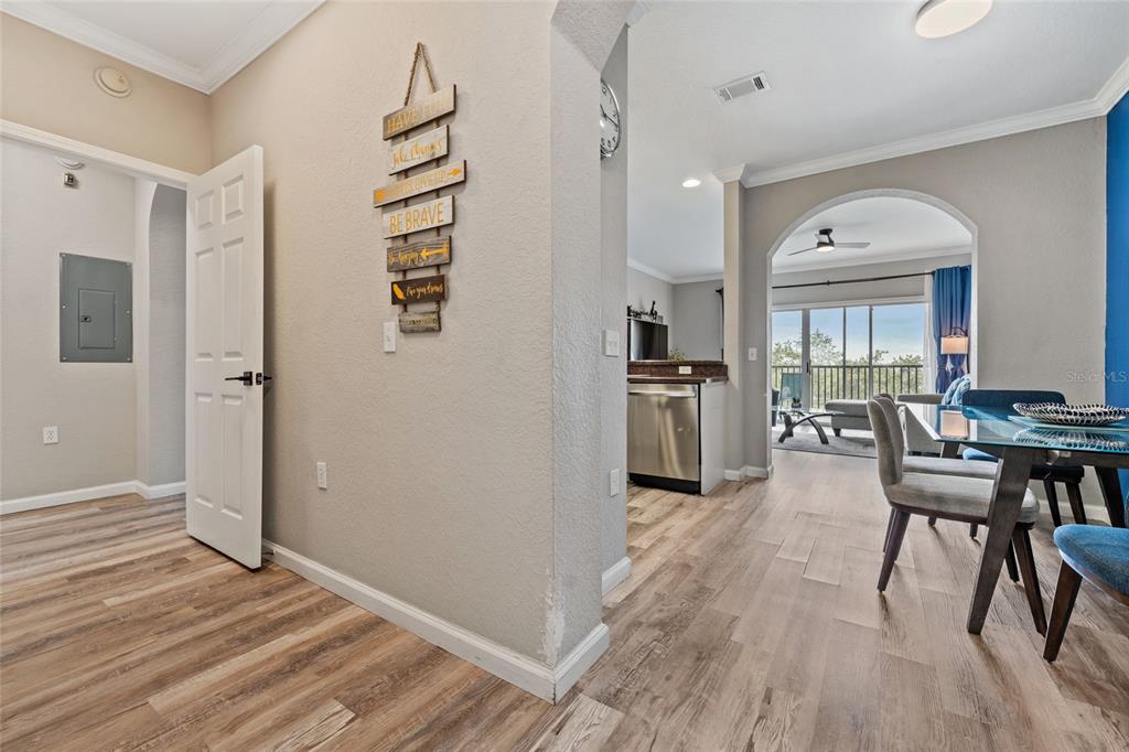 14200 Avalon Road, Unit 409 Winter Garden, FL 34787 - Photo 9 of 33 a view of a dining room with furniture window and wooden floor