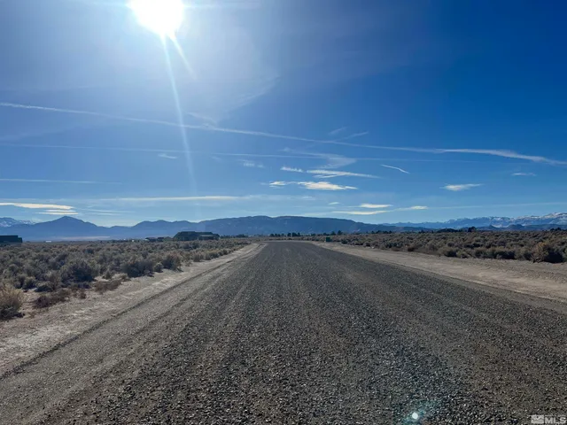 a view of an ocean and a yard