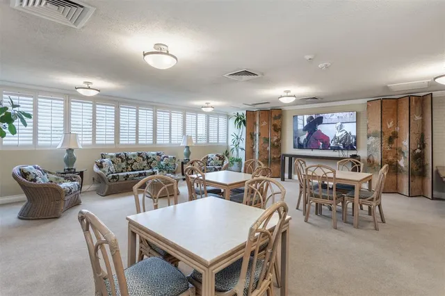 a view of a house with backyard porch and sitting area