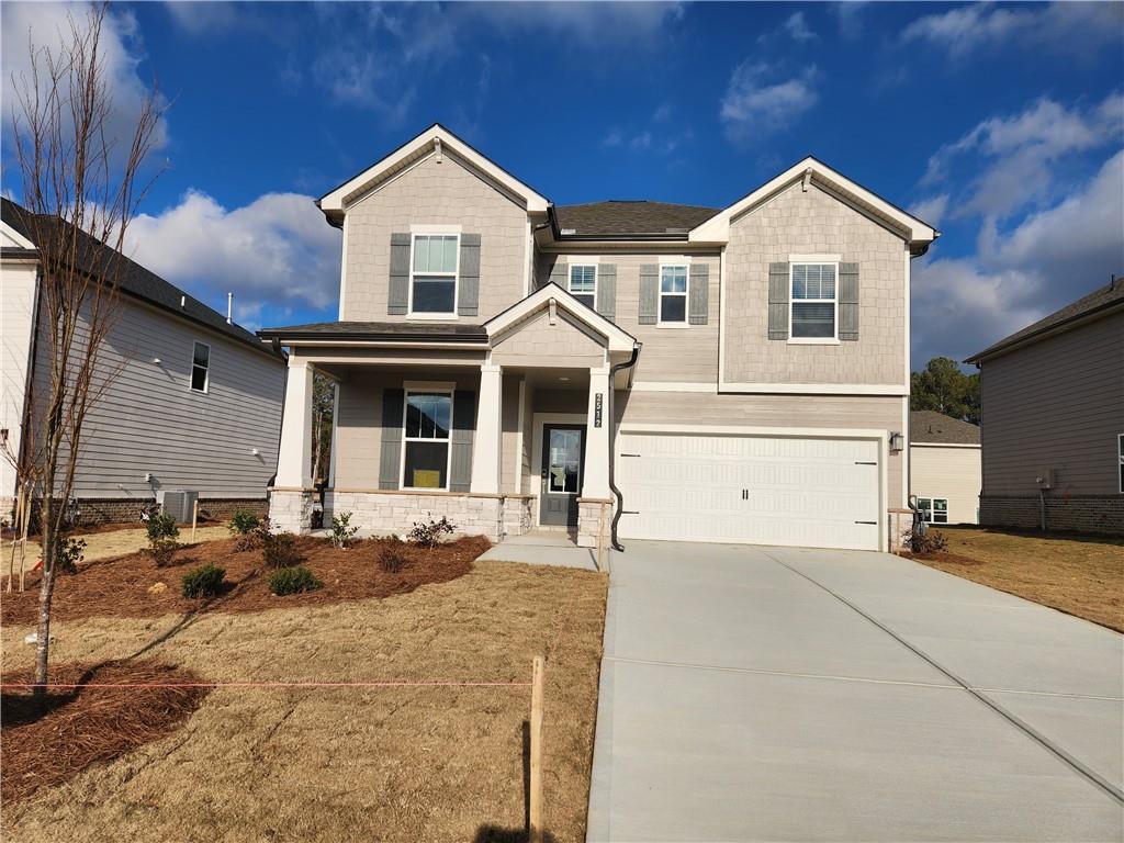 2512 Brown Dove Way Grayson, GA 30017 - Photo 1 of 1 a front view of a house with a yard