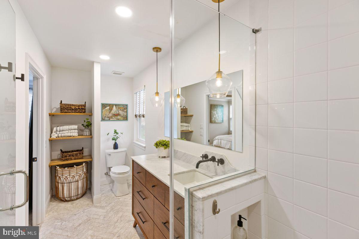1401 Carol Road Jenkintown, PA 19046 - Photo 17 of 30 a bathroom with a sink a vanity and a mirror