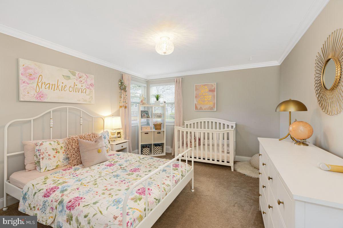 1401 Carol Road Jenkintown, PA 19046 - Photo 18 of 30 a bedroom with a bed and wooden floor