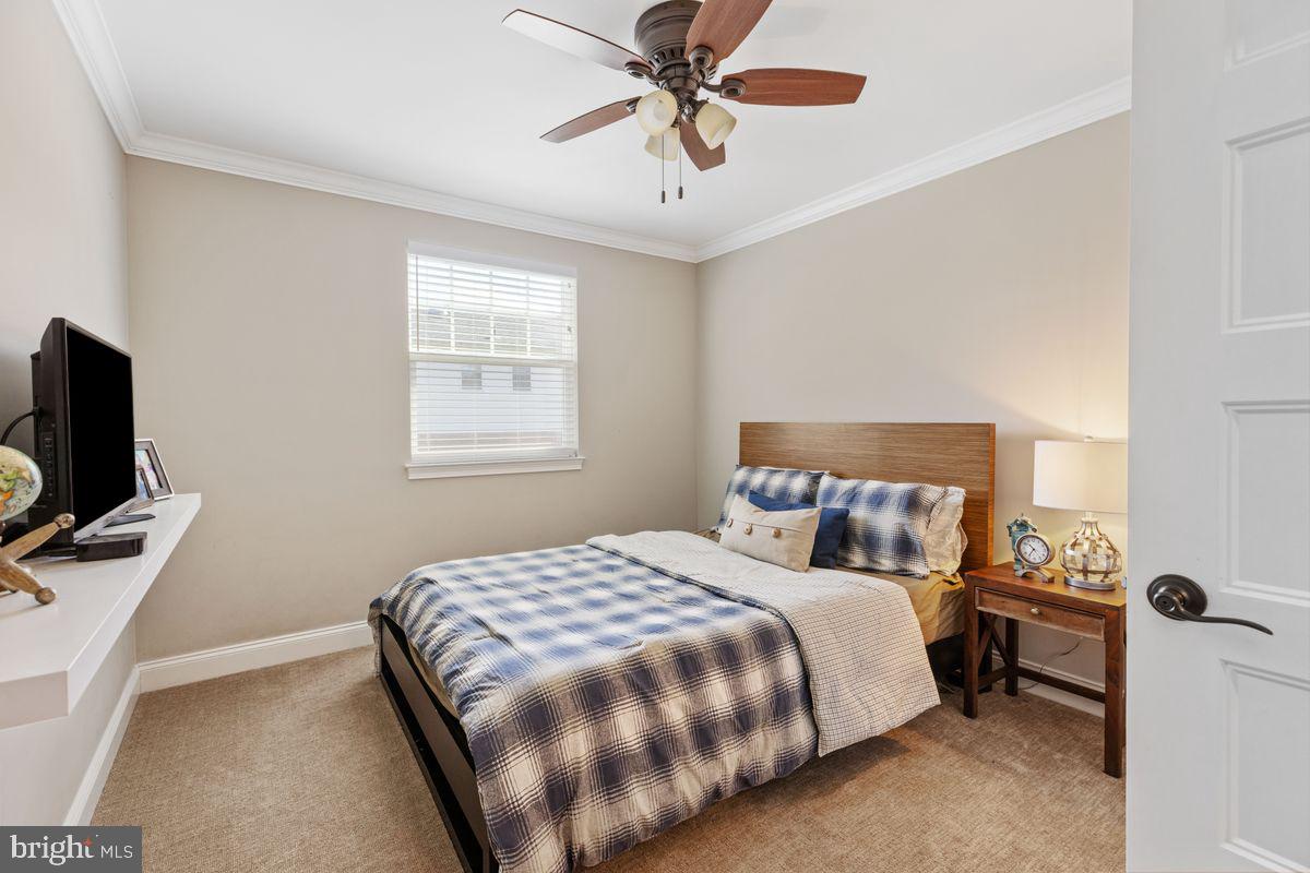1401 Carol Road Jenkintown, PA 19046 - Photo 19 of 30 a bedroom with a bed and a flat tv screen on the dresser