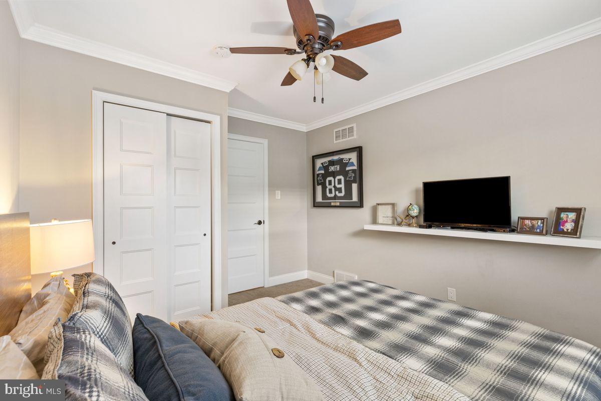 1401 Carol Road Jenkintown, PA 19046 - Photo 20 of 30 a bedroom with a bed and a flat screen tv