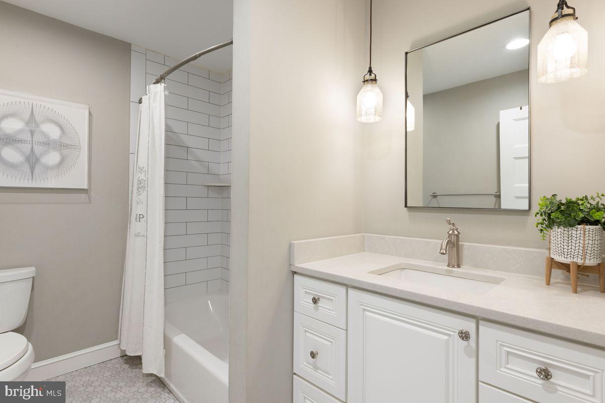 1401 Carol Road Jenkintown, PA 19046 - Photo 22 of 30 a bathroom with a sink a toilet and shower