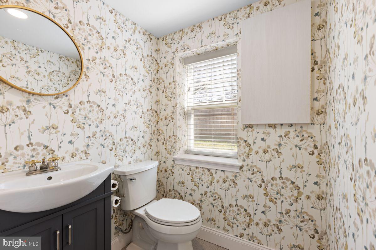 1401 Carol Road Jenkintown, PA 19046 - Photo 25 of 30 a bathroom with a sink a toilet and a mirror