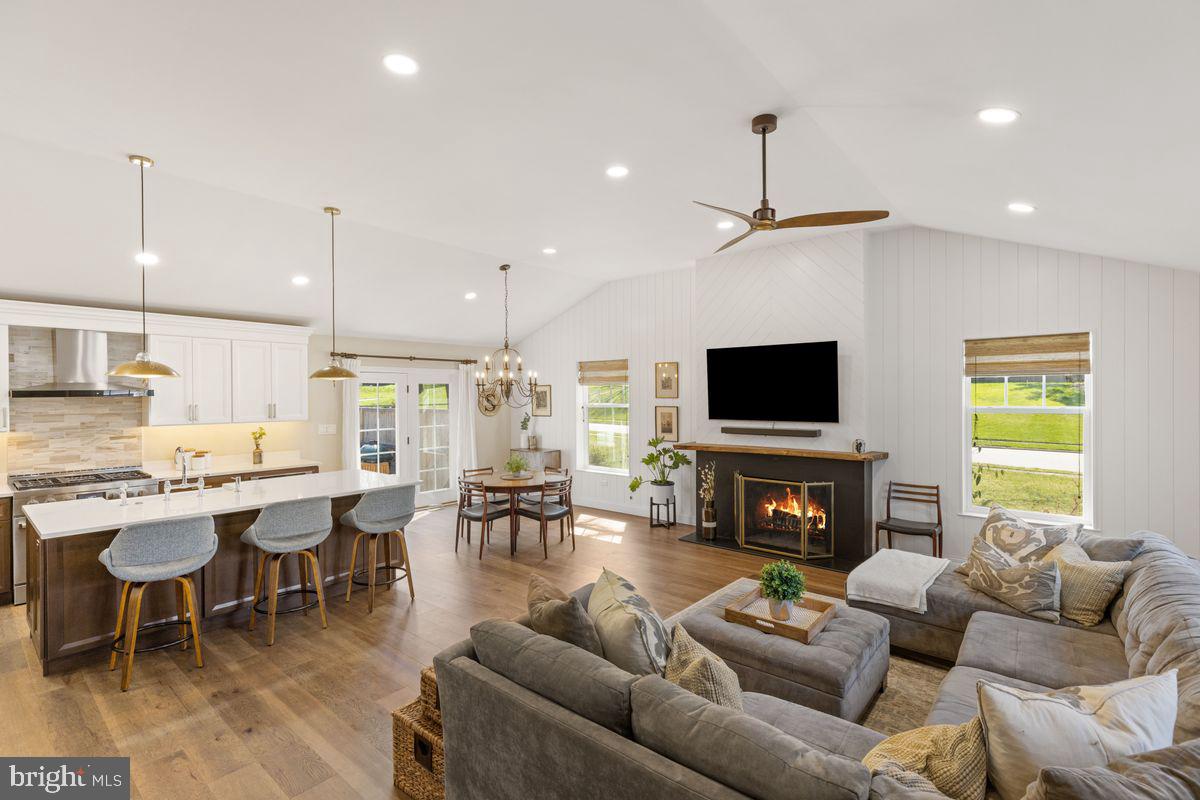 1401 Carol Road Jenkintown, PA 19046 - Photo 3 of 30 a living room with furniture a flat screen tv and a fireplace