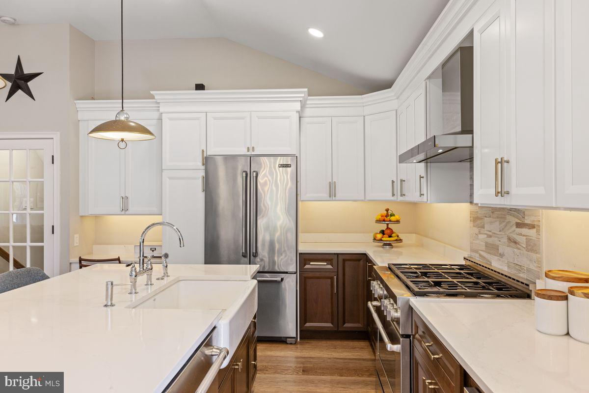 1401 Carol Road Jenkintown, PA 19046 - Photo 7 of 30 a kitchen with kitchen island a sink stove and refrigerator